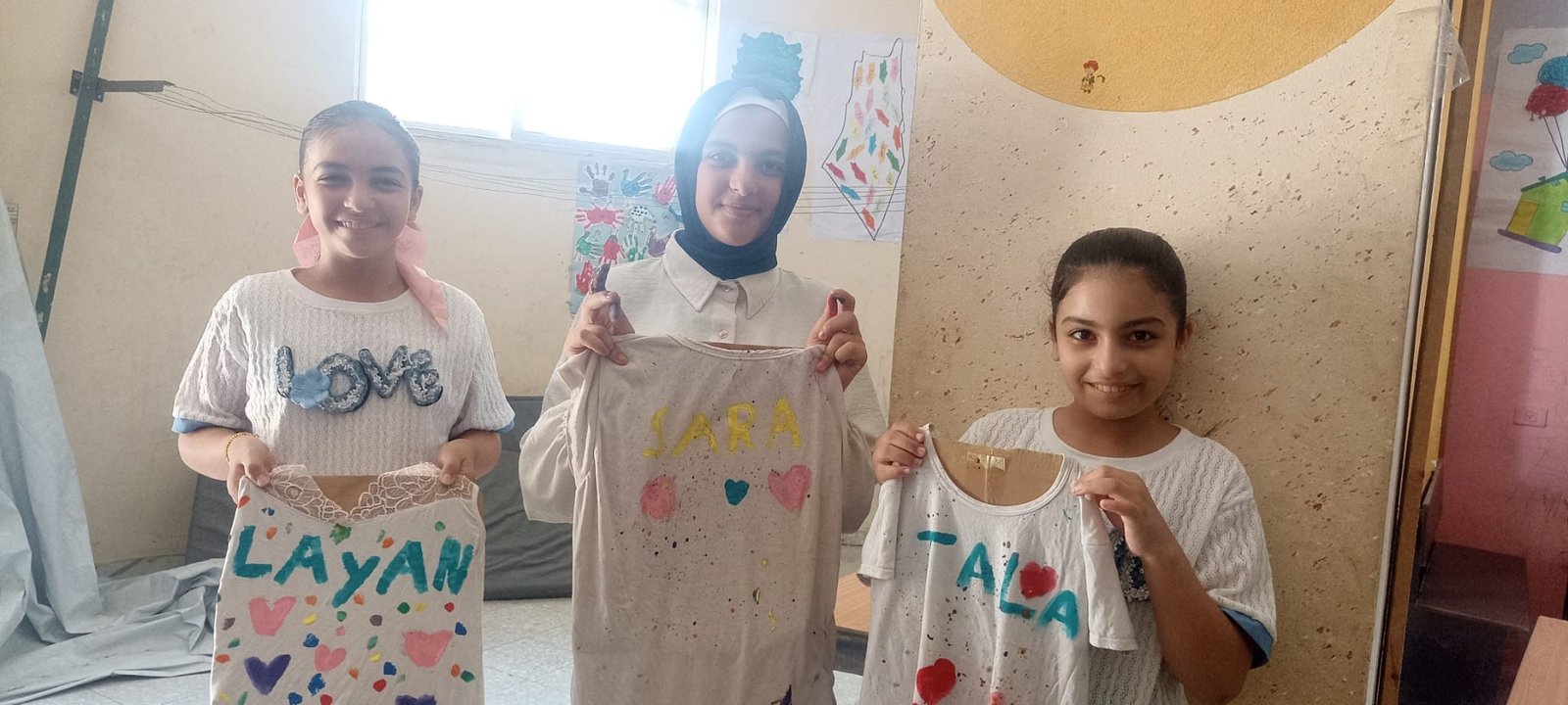 Children Explore Creativity through “Free Painting on Clothes” at Mothers of Hind School Summer Camp